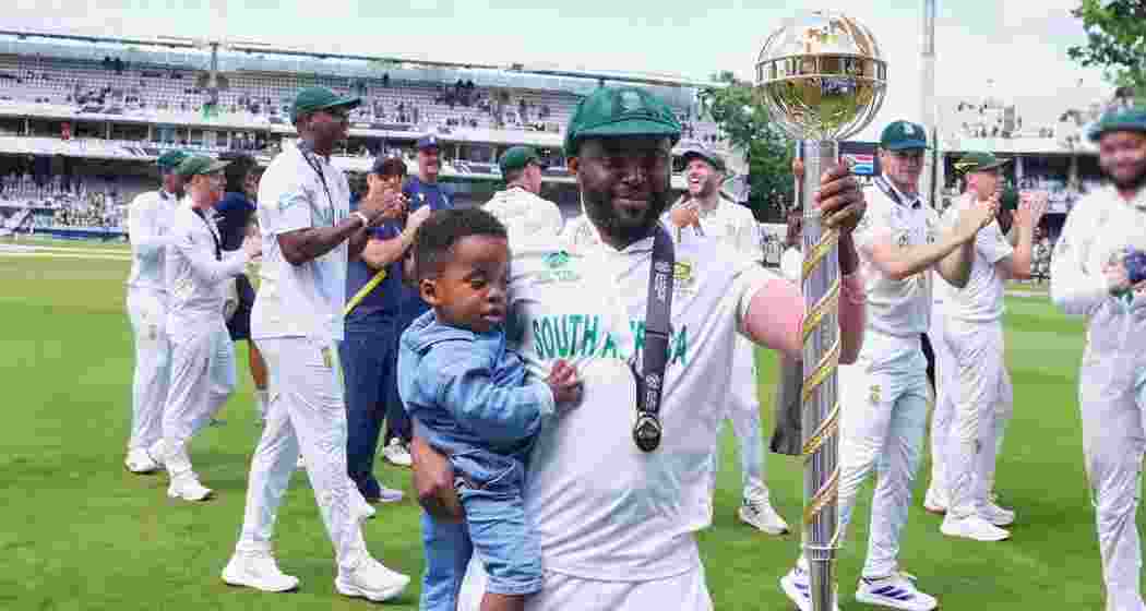 South Africa's captain Temba Bavuma holds the winner's trophy after their win in the World Test Championship against Australia at Lord's cricket ground in London on Saturday.
