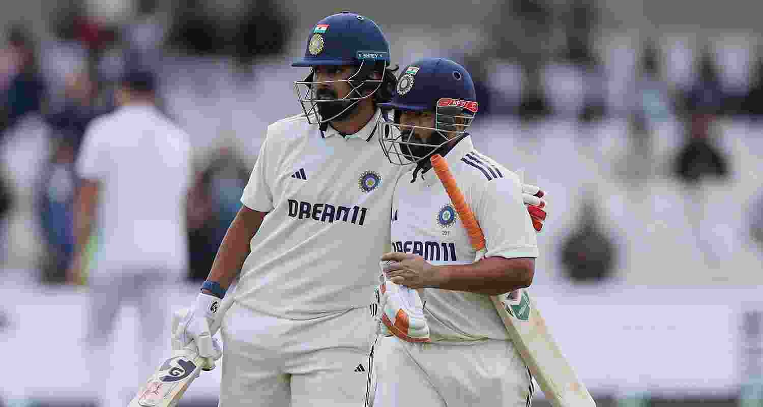 Rishabh Pant (right) celebrates with teammate KL Rahul after scoring a century on the fourth day of the first Test match between England and India at Headingley in Leeds on Monday.