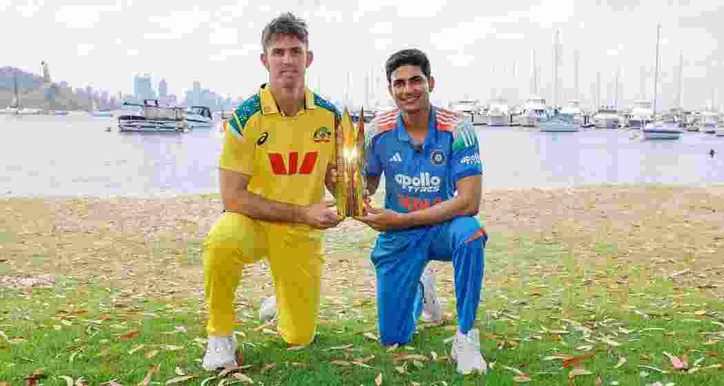 India's captain Shubman Gill and his Australian counterpart Mitchell Marsh pose with the trophy ahead of the three-match ODI series beginning on Sunday.