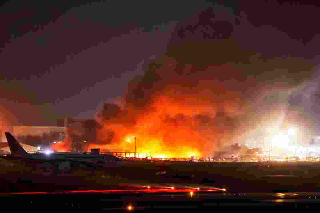 Thick smoke rises from the cargo complex of Hazrat Shahjalal International Airport in Dhaka after a major fire forced suspension of flights. 