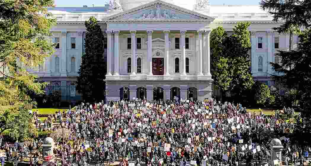 Several hundred demonstrators rally against President Donald Trump outside the California State Capitol on Wednesday, Feb. 5, 2025, in Sacramento, Calif.