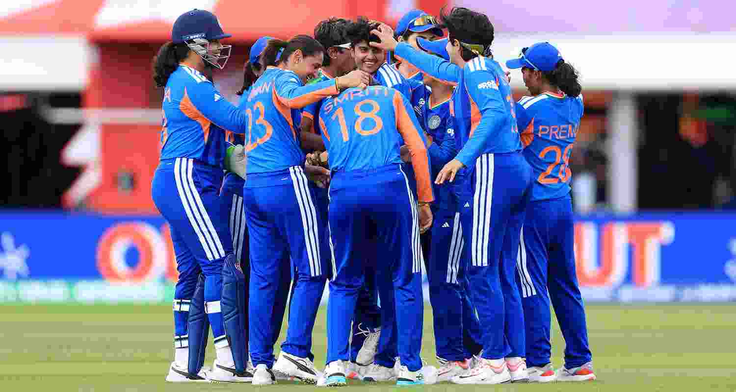 India's Shree Charani celebrates bowling and catching out South Africa's Laura Wolvaardt during the ICC Women's T20 World Cup match between India and South Africa.