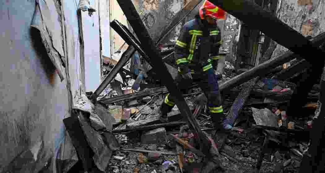A rescue worker walks inside apartments destroyed by a Russian strike in Odesa, Ukraine, on Monday.