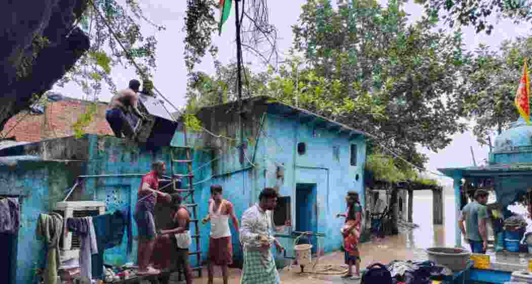 Floodwaters from the Yamuna breach banks in Delhi’s Yamuna Bazaar, forcing residents to move to relief camps.