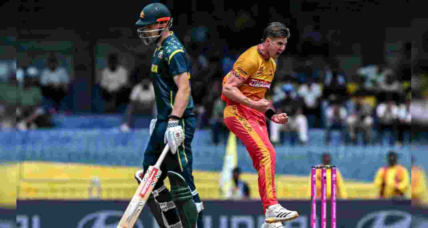 Brad Evans (3/23) celebrating the fall of an Australian wicket.