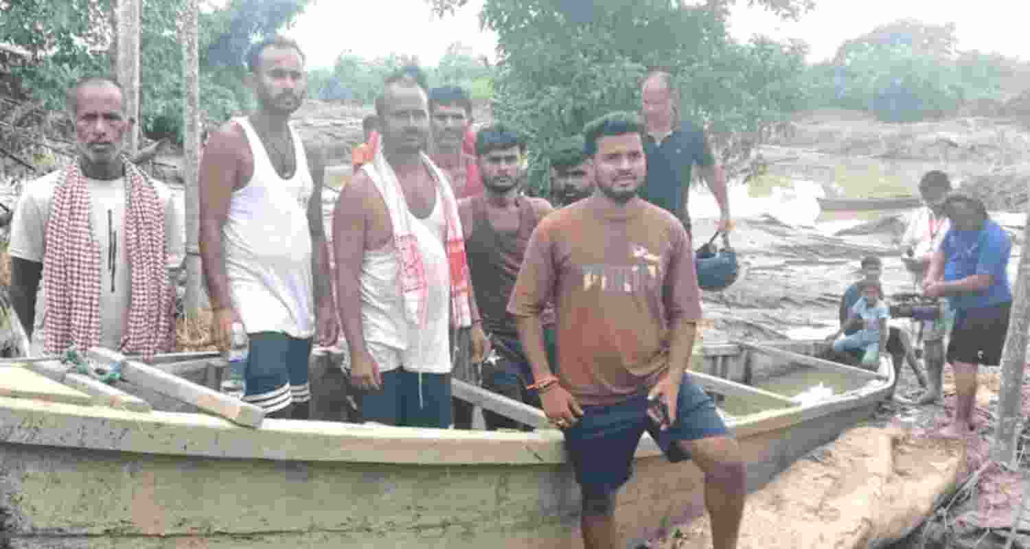 Flood-affected people in Sivasagar district being evacuated to safer places.