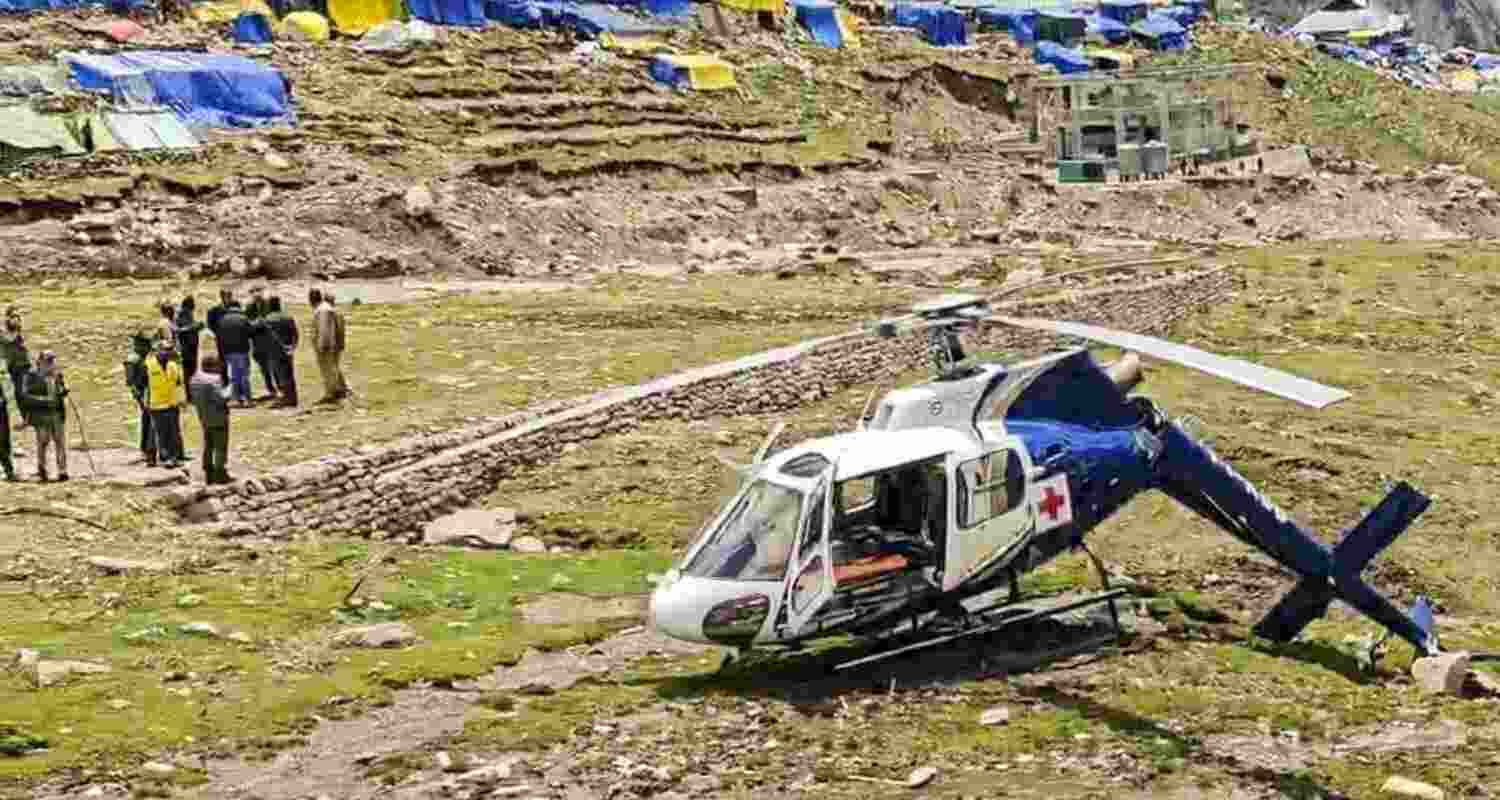 A damaged helicopter of AIIMS Rishikesh’s heli ambulance service after it crashed while landing, at Kedarnath in Uttarakhand on Saturday. A damaged helicopter of AIIMS Rishikesh’s heli ambulance service after it crashed while landing, at Kedarnath in Uttarakhand on Saturday.