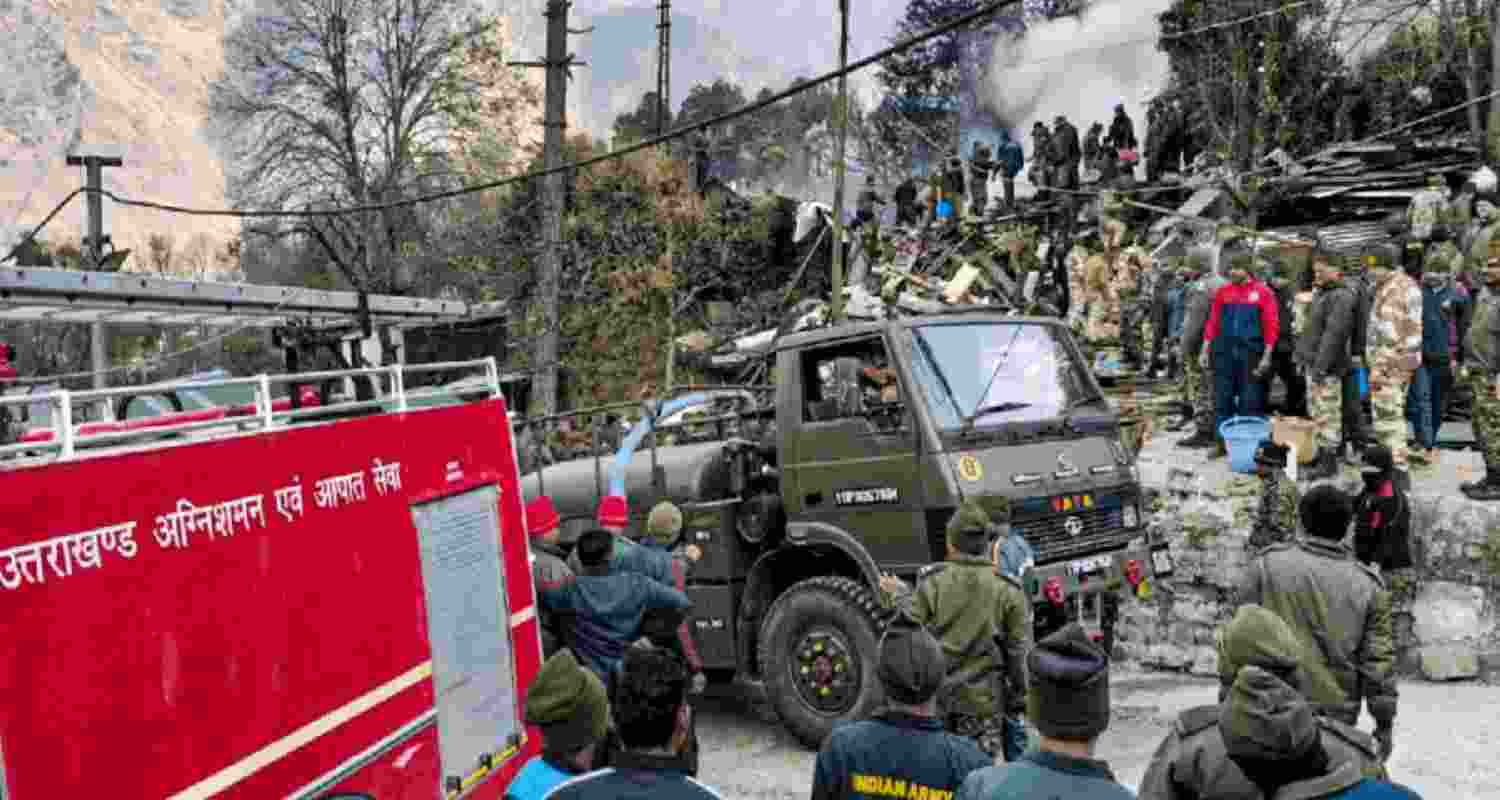 Army personnel gather as firefighters douse a fire that broke out in a store located inside an Army camp, on the Auli Road at Joshimath in Chamoli district, Uttarakhand. Army personnel gather as firefighters douse a fire that broke out in a store located inside an Army camp, on the Auli Road at Joshimath in Chamoli district, Uttarakhand.