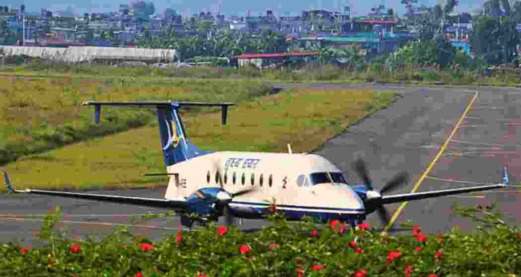 An aircraft moves along the runway at Bagdogra International Airport An aircraft moves along the runway at Bagdogra International Airport
