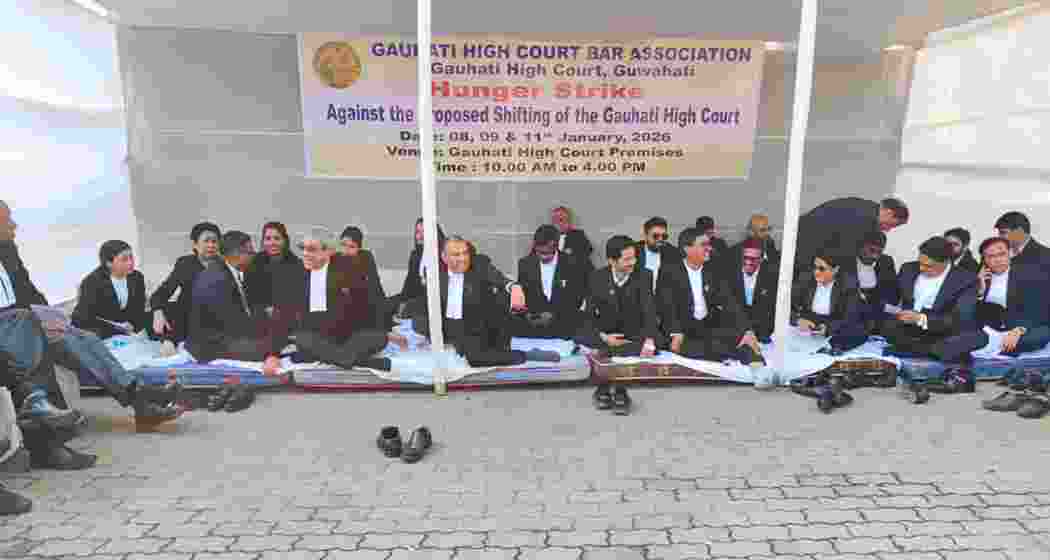 Members of the Gauhati High Court Bar Association sit on a hunger strike in front of the high court building at Uzan Bazar, protesting the proposed relocation of the court complex. Members of the Gauhati High Court Bar Association sit on a hunger strike in front of the high court building at Uzan Bazar, protesting the proposed relocation of the court complex.