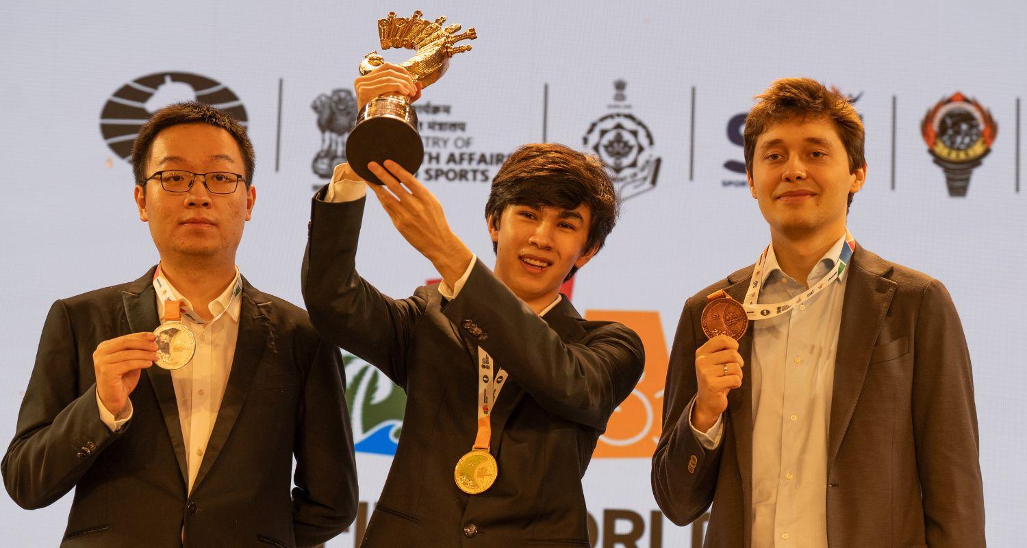 Javokhir Sindarov lifting the Viswanathan Anand Cup after beating Wei Yi of China (left), while Andrey Esipenko (extreme right) finished as the second runner-up at the FIDE World Cup in Panaji on Wednesday. Javokhir Sindarov lifting the Viswanathan Anand Cup after beating Wei Yi of China (left), while Andrey Esipenko (extreme right) finished as the second runner-up at the FIDE World Cup in Panaji on Wednesday.