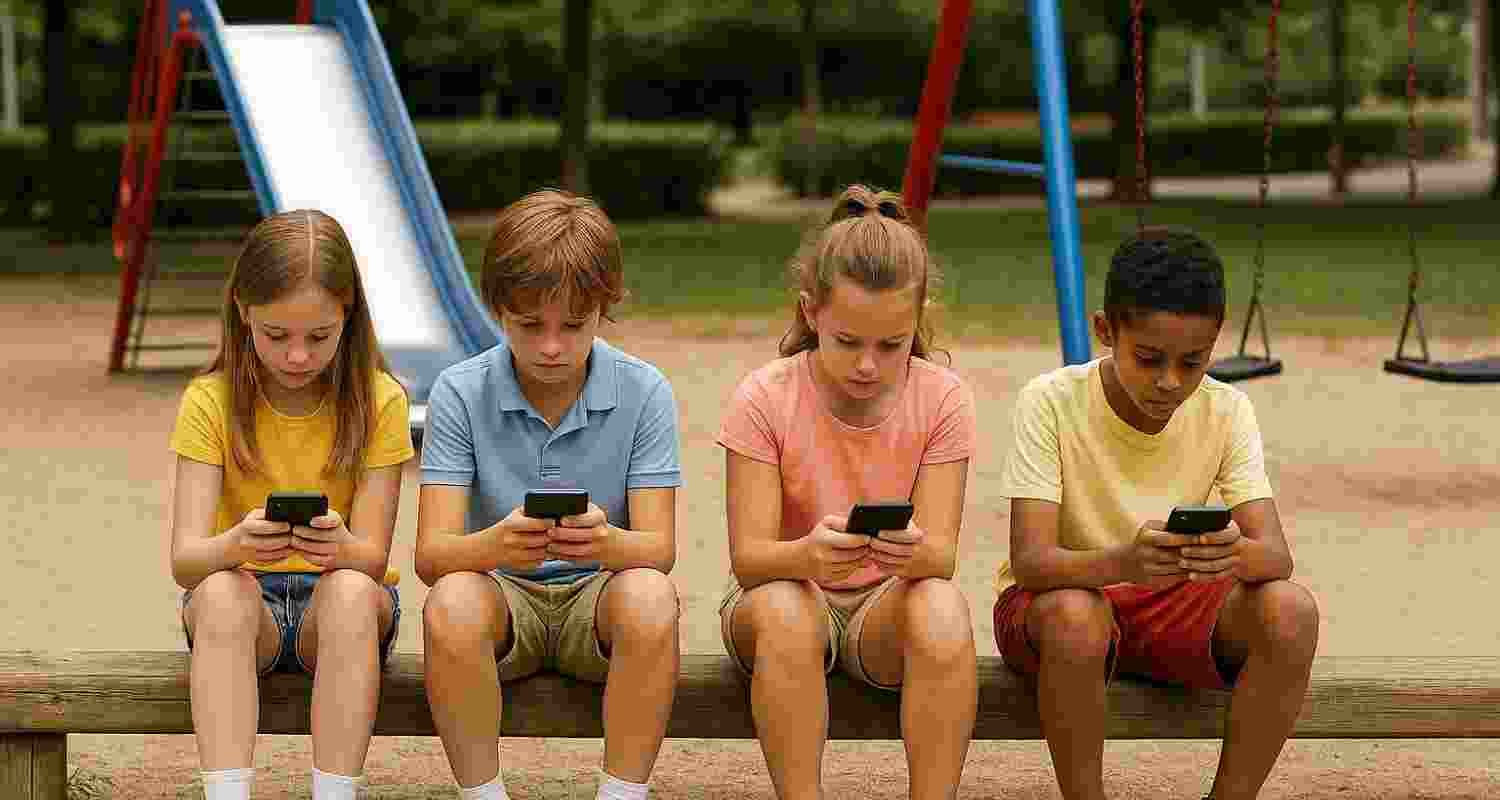 Children scrolling on their phones at the park, while the swings and slides remain empty. Children scrolling on their phones at the park, while the swings and slides remain empty.