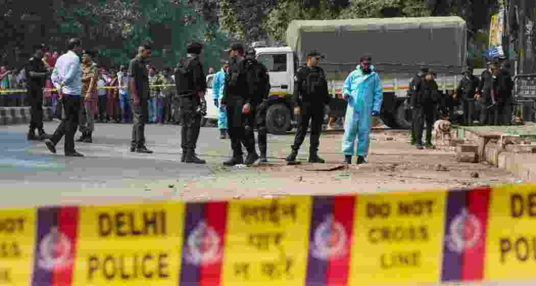 National Security Guard (NSG) personnel inspect the site after the blast in Rohini area of New Delhi. (Photo: PTI) National Security Guard (NSG) personnel inspect the site after the blast in Rohini area of New Delhi. (Photo: PTI)