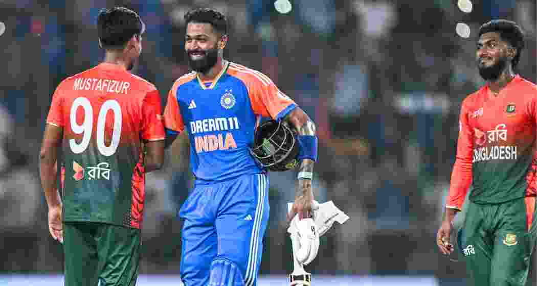 India's Hardik Pandya (C) shakes hands with Bangladesh's Mustafizur Rahman at the end of a T20I match in Gwalior. India's Hardik Pandya (C) shakes hands with Bangladesh's Mustafizur Rahman at the end of a T20I match in Gwalior.