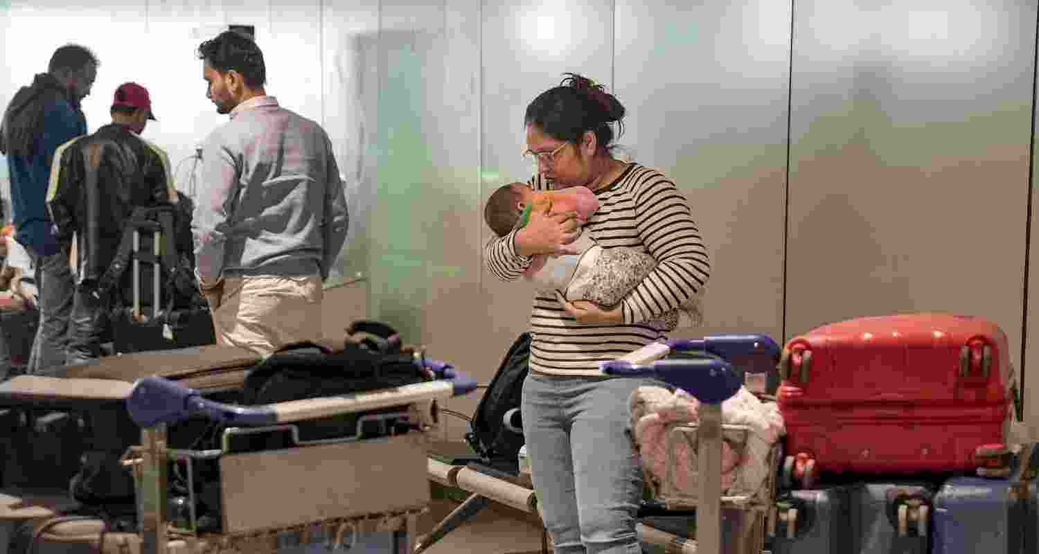A passenger looks after a newborn baby as she waits at Terminal 1 (T1) of the Indira Gandhi International Airport, in New Delhi, Saturday, Dec. 6, 2025. Domestic carrier IndiGo has cancelled over 200 flights from Delhi and Mumbai on Saturday, a day after managing to temporarily secure major relaxations in the second phase of the court-mandated new flight duty and rest period norms for cockpit crew, sources said. A passenger looks after a newborn baby as she waits at Terminal 1 (T1) of the Indira Gandhi International Airport, in New Delhi, Saturday, Dec. 6, 2025. Domestic carrier IndiGo has cancelled over 200 flights from Delhi and Mumbai on Saturday, a day after managing to temporarily secure major relaxations in the second phase of the court-mandated new flight duty and rest period norms for cockpit crew, sources said.