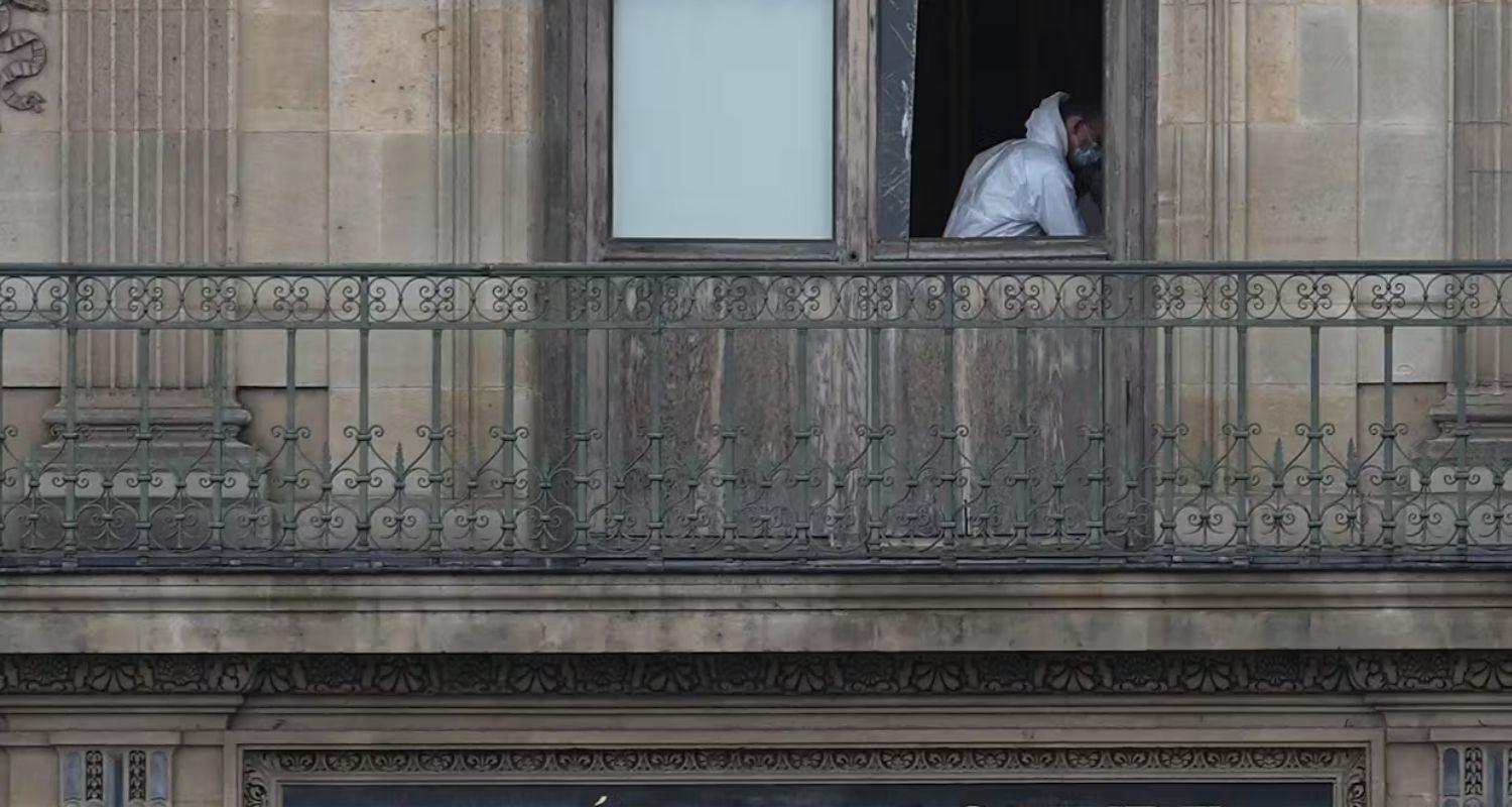 A police officer works inside the Louvre museum on Sunday. A police officer works inside the Louvre museum on Sunday.