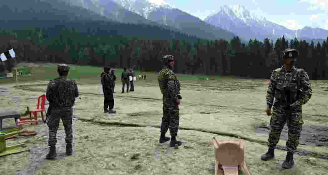 Military personnel keep a vigilant watch and assess the aftermath following the Pahalgam attack. Military personnel keep a vigilant watch and assess the aftermath following the Pahalgam attack.
