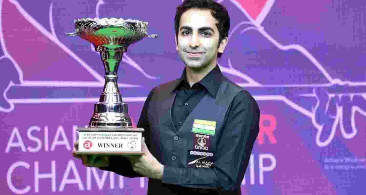 Pankaj Advani posing with the winner's trophy. Pankaj Advani posing with the winner's trophy.