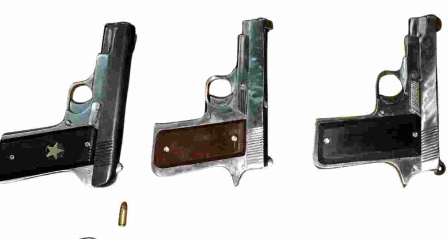 Seized .32 calibre pistols with live cartridges from the accused. Seized .32 calibre pistols with live cartridges from the accused.