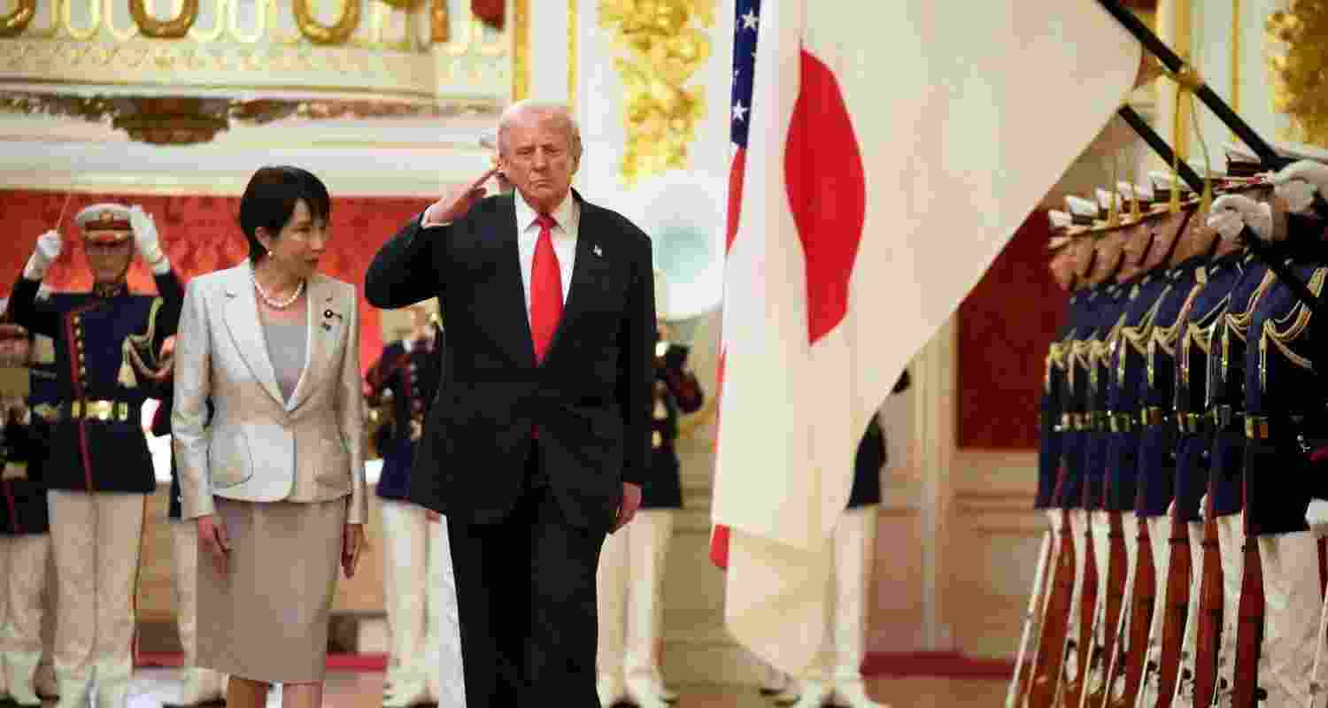 President Donald Trump, center, reviews an honour guard, escorted by Japan's Prime Minister Sanae Takaichi on his arrival at Akasaka Palace in Tokyo, Japan, Tuesday. President Donald Trump, center, reviews an honour guard, escorted by Japan's Prime Minister Sanae Takaichi on his arrival at Akasaka Palace in Tokyo, Japan, Tuesday.