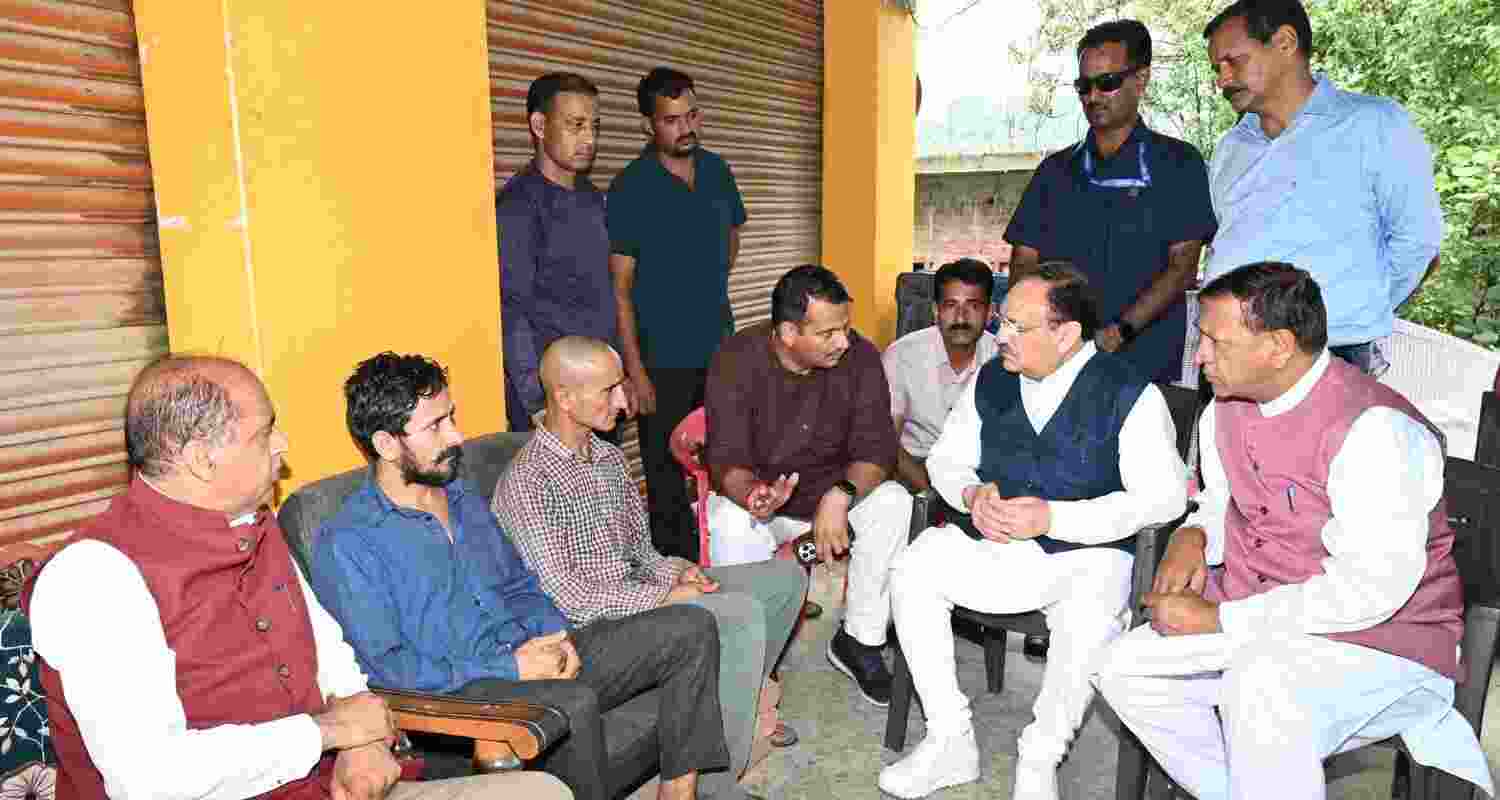 Union Minister and BJP National President JP Nadda meets families hit by floods in Mandi on Wednesday. Union Minister and BJP National President JP Nadda meets families hit by floods in Mandi on Wednesday.