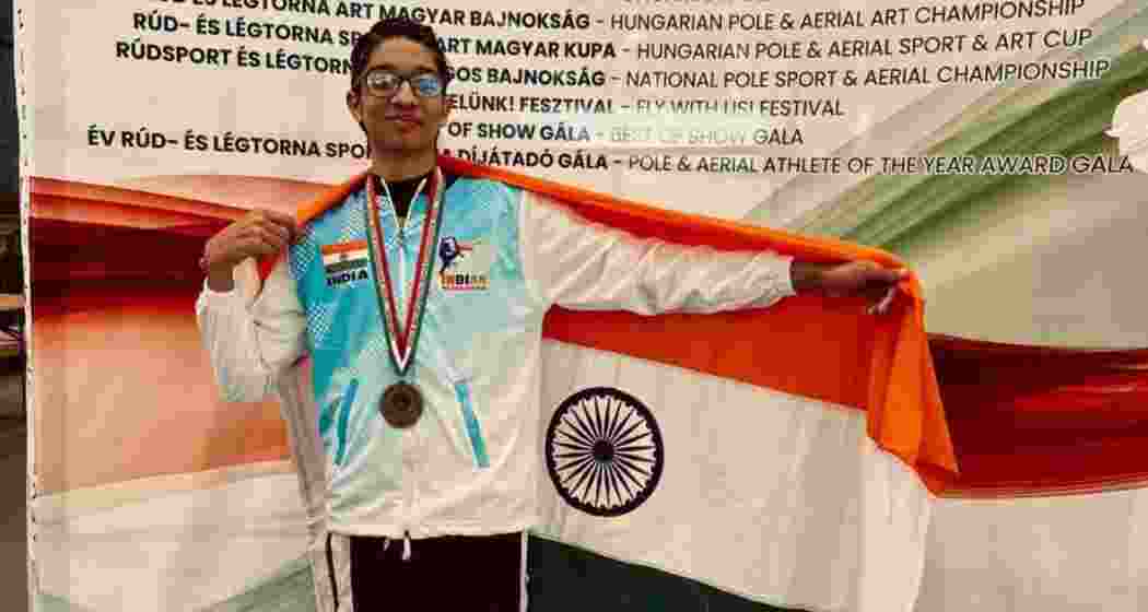 Vir Gahrotra poses with the Tricolour after his gold-winning aerial silks routine at the World Championship in Budapest. Vir Gahrotra poses with the Tricolour after his gold-winning aerial silks routine at the World Championship in Budapest.