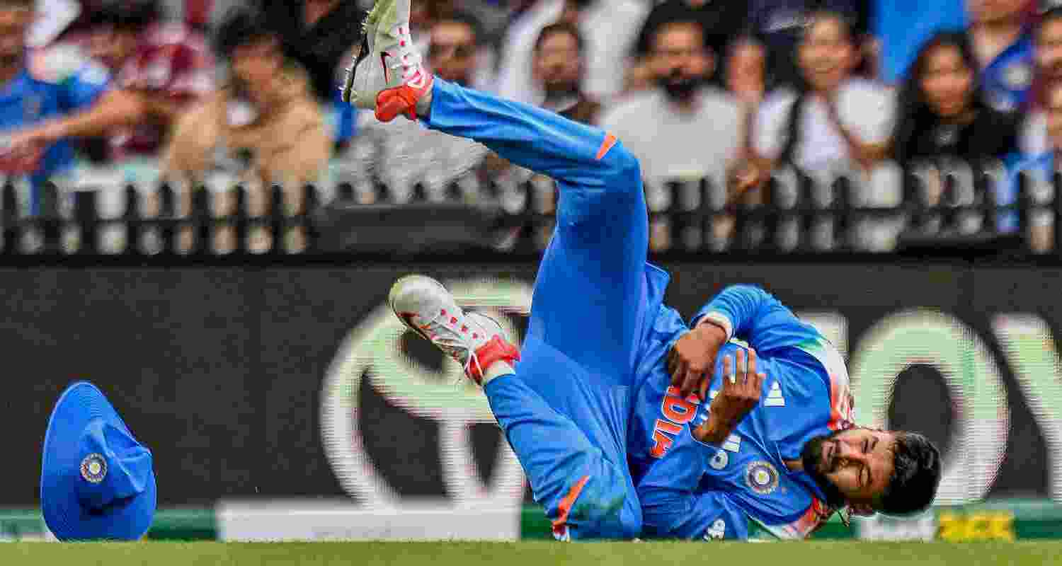 Shreyas Iyer reacts after sustaining an injury while taking the catch of Australia's Alex Carey during the third ODI cricket match between India and Australia in Sydney on Saturday. Shreyas Iyer reacts after sustaining an injury while taking the catch of Australia's Alex Carey during the third ODI cricket match between India and Australia in Sydney on Saturday.