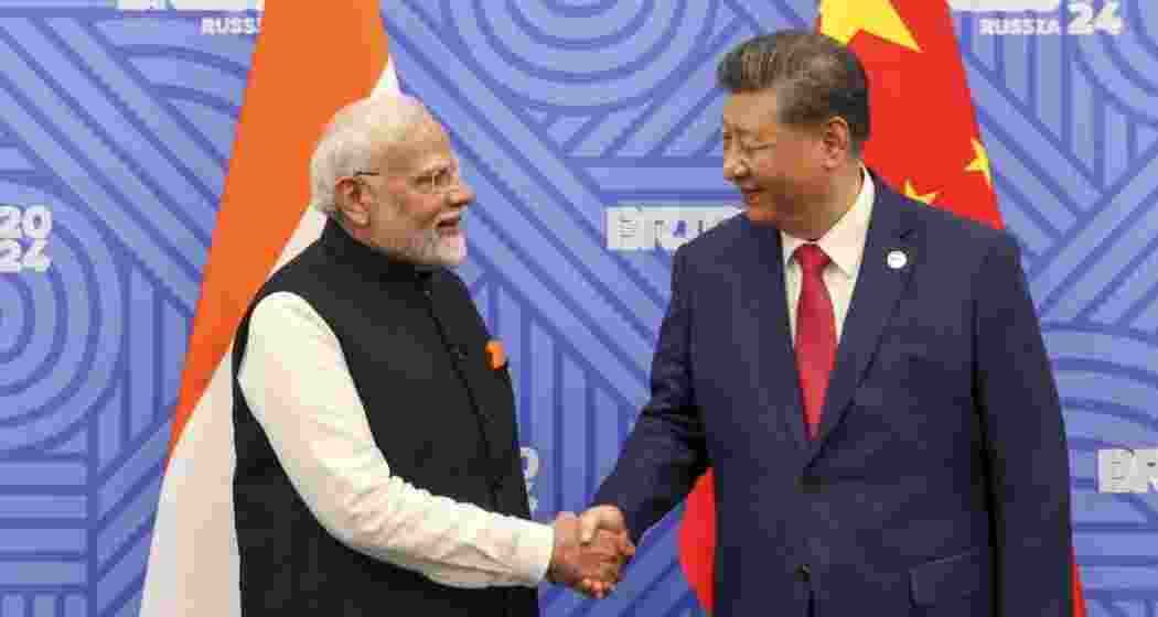 Chinese President Xi Jinping greets Prime Minister Narendra Modi on the sidelines of the BRICS summit in Kazan, Russia. Chinese President Xi Jinping greets Prime Minister Narendra Modi on the sidelines of the BRICS summit in Kazan, Russia.