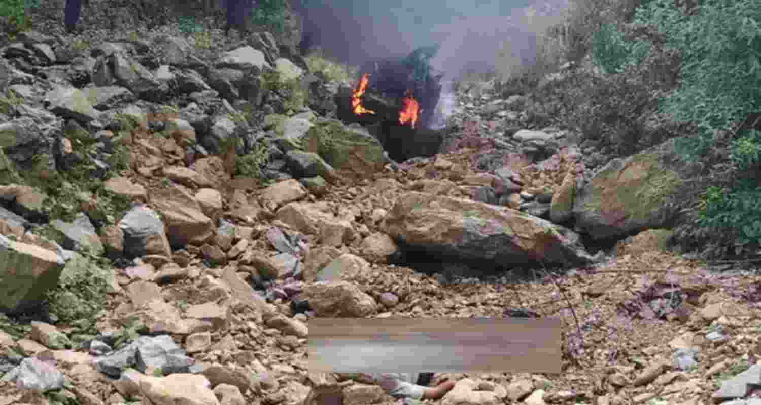 A newly purchased car seen engulfed in flames after it fell into a gorge in Champawat, Uttarakhand, killing two persons and injuring three others. A newly purchased car seen engulfed in flames after it fell into a gorge in Champawat, Uttarakhand, killing two persons and injuring three others.