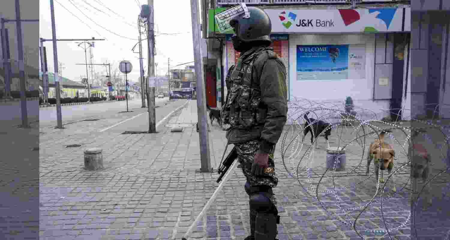 A security personnel stands guard amid restrictions imposed as a precautionary measure, few days after the killing of Iran's Supreme Leader Ayatollah Ali Khamenei in a US-Israel strike, in Srinagar. A security personnel stands guard amid restrictions imposed as a precautionary measure, few days after the killing of Iran's Supreme Leader Ayatollah Ali Khamenei in a US-Israel strike, in Srinagar.