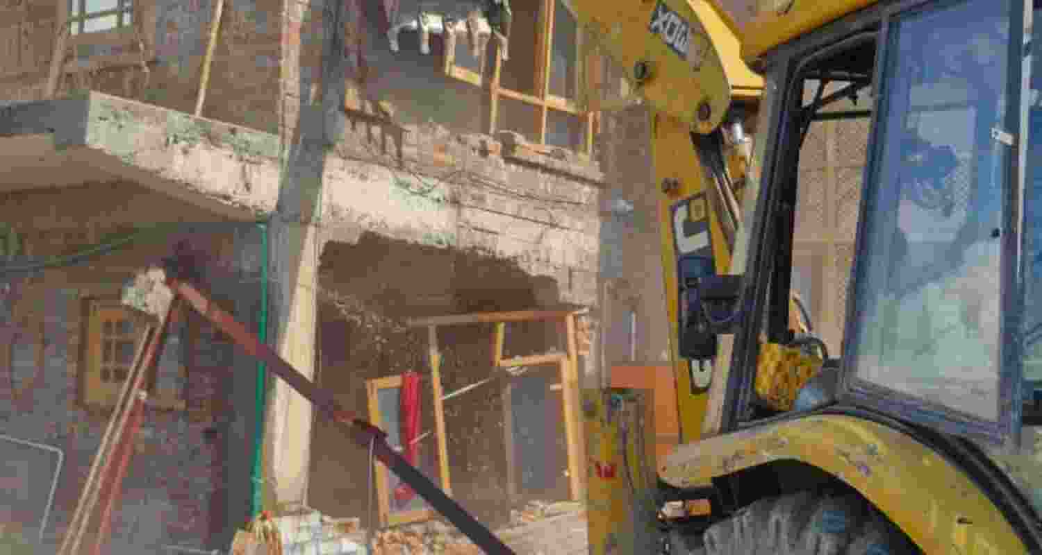 A three-storey structure linked to an alleged drug peddler is demolished during a joint police-revenue department operation in Srinagar. A three-storey structure linked to an alleged drug peddler is demolished during a joint police-revenue department operation in Srinagar.