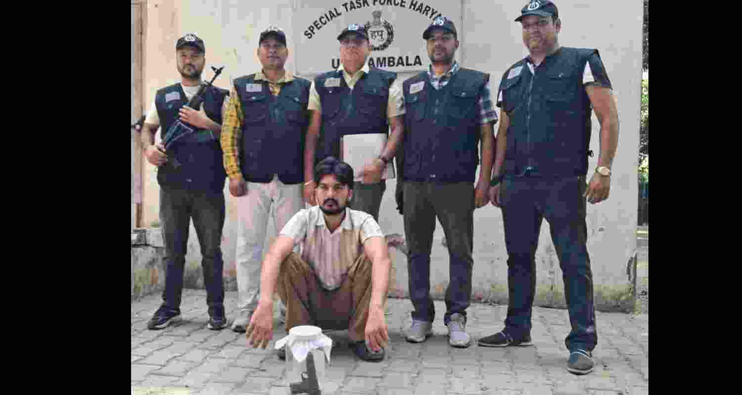 Accused Surya Pratap being taken into custody by STF Ambala in grenade recovery case. Accused Surya Pratap being taken into custody by STF Ambala in grenade recovery case.
