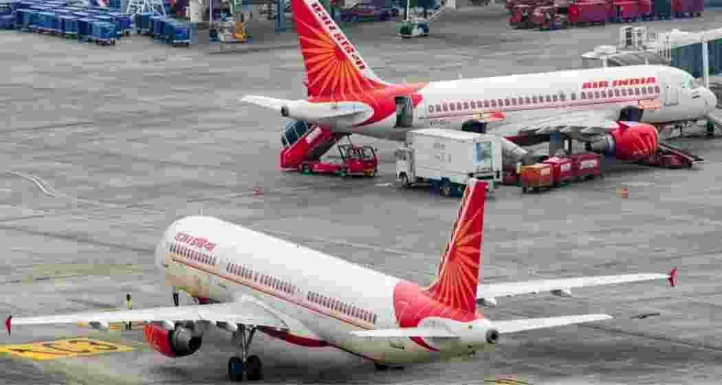 An Air India aircraft rests on the tarmac. An Air India aircraft rests on the tarmac.