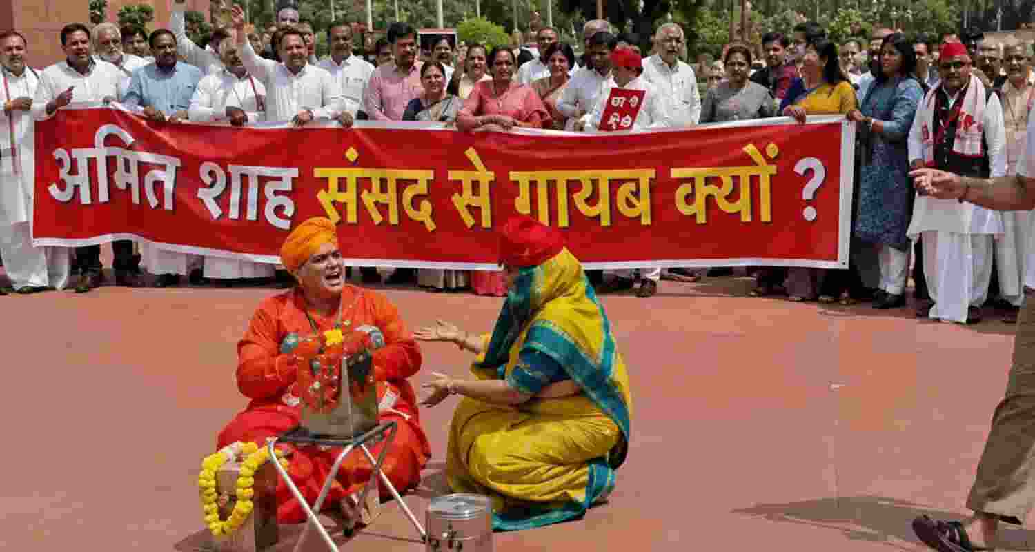 Opposition MPs protested in Parliament, demanding Amit Shah's response to the July 20 police action against students during the NEET paper leak protests. Opposition MPs protested in Parliament, demanding Amit Shah's response to the July 20 police action against students during the NEET paper leak protests.