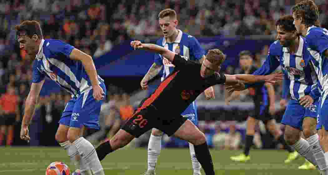 Barcelona's Daniel Olmo (C) contests the ball during the LaLiga match against Espanyol at the RCDE Stadium in Cornella de Llobregat on Thursday, 15 May 2025. Barcelona's Daniel Olmo (C) contests the ball during the LaLiga match against Espanyol at the RCDE Stadium in Cornella de Llobregat on Thursday, 15 May 2025.