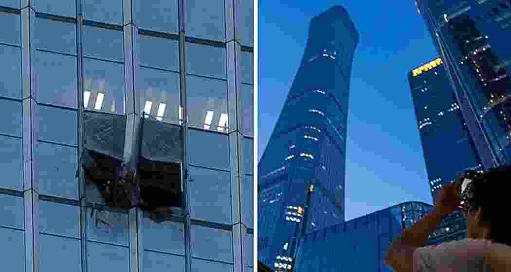 A man looks at damage to the CITIC Tower, also known as China Zun, after a light aircraft crashed into the skyscraper in Beijing, China, on Friday. AP/PTI A man looks at damage to the CITIC Tower, also known as China Zun, after a light aircraft crashed into the skyscraper in Beijing, China, on Friday. AP/PTI