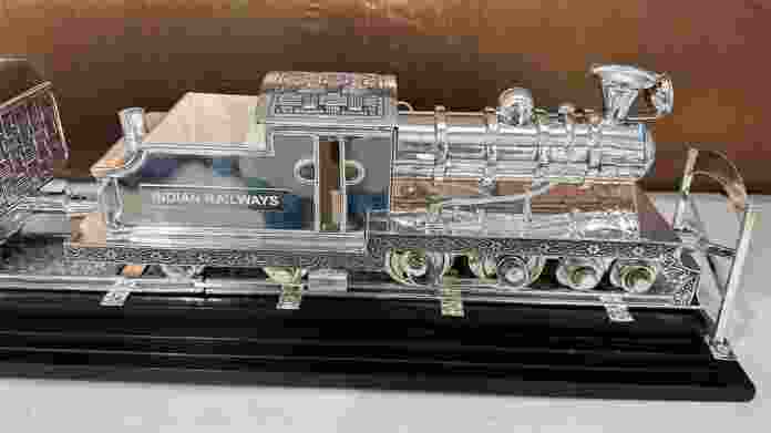 The train model was made with antique silver and hand-engraved, a rare and extraordinary piece masterfully crafted by artisans from Maharashtra; the shawl was a tribute to the extraordinary talent of Kashmiri craftspersons.. The train model was made with antique silver and hand-engraved, a rare and extraordinary piece masterfully crafted by artisans from Maharashtra; the shawl was a tribute to the extraordinary talent of Kashmiri craftspersons..