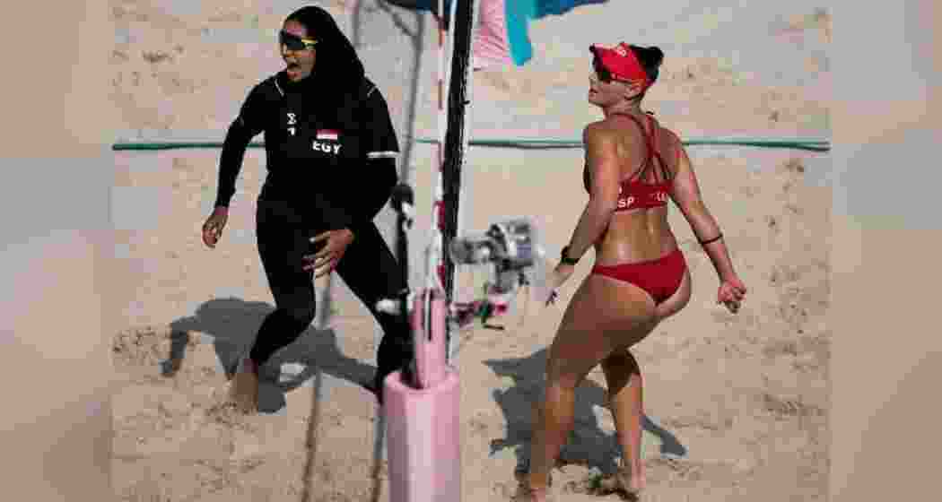 Spain and Egypt players compete in an intense beach volleyball match during the Paris Olympics. Spain and Egypt players compete in an intense beach volleyball match during the Paris Olympics.