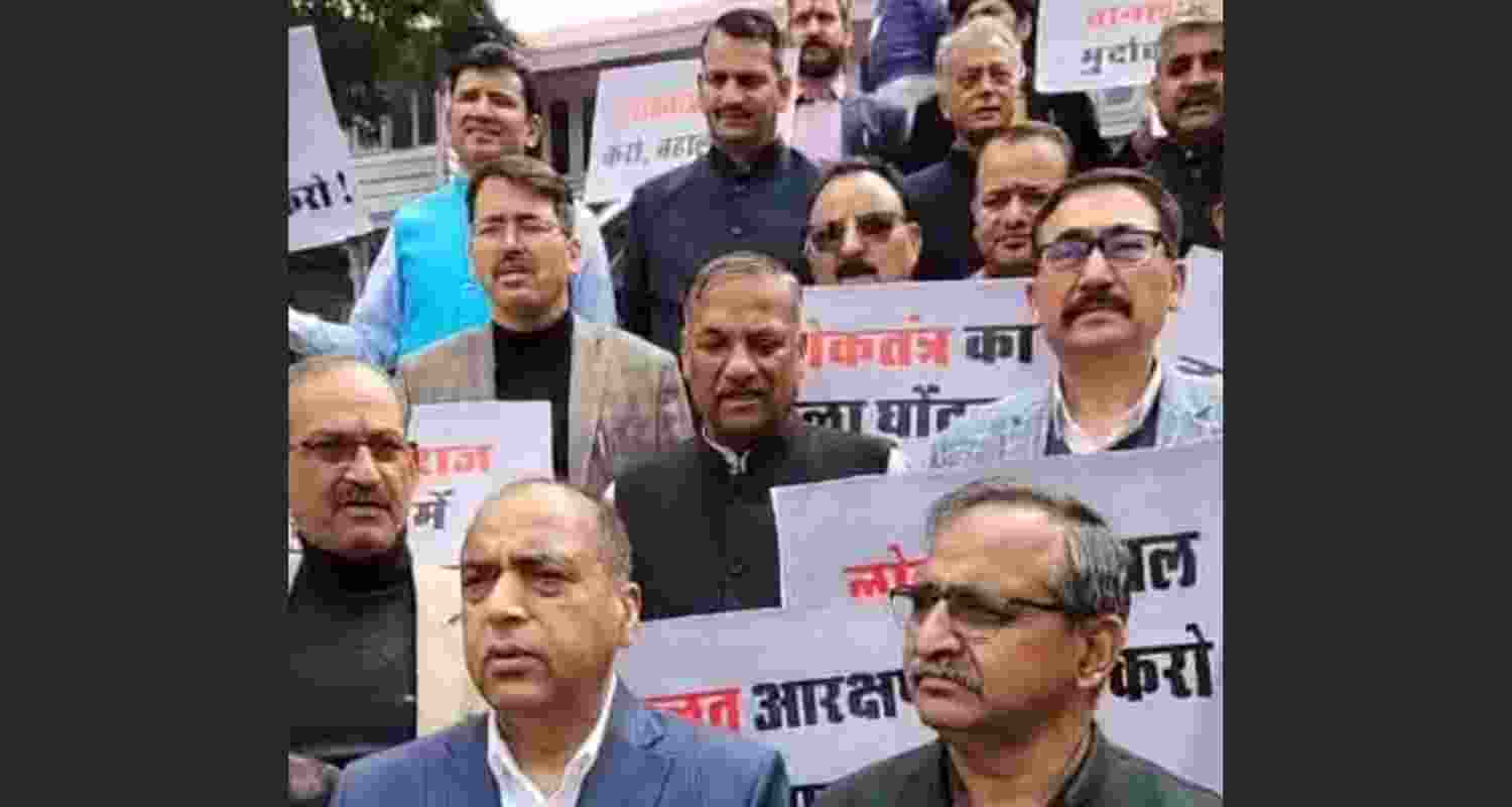 BJP MLAs demonstrate outside the Assembly against the government’s decision on reservation roster discretion for Panchayat elections. BJP MLAs demonstrate outside the Assembly against the government’s decision on reservation roster discretion for Panchayat elections.