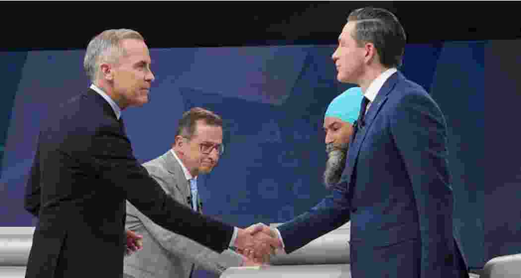 Liberal Leader Mark Carney shakes hands with Conservative Leader Pierre Poilievre following the French-language federal leaders' debate, in Montreal. Liberal Leader Mark Carney shakes hands with Conservative Leader Pierre Poilievre following the French-language federal leaders' debate, in Montreal.