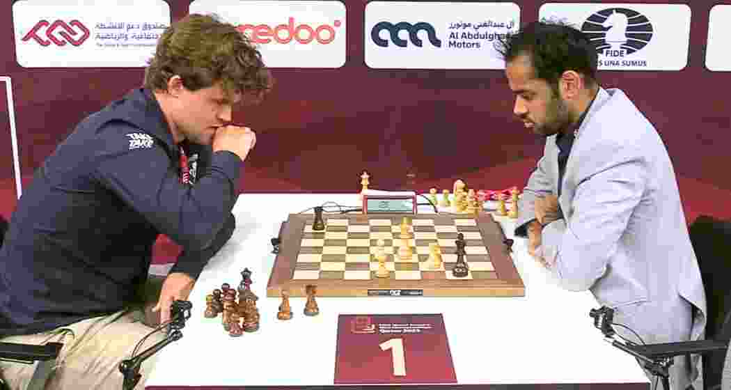 Magnus Carlsen and Arjun Erigaisi in action at the FIDE World Rapid Championships in Doha, where the Indian Grandmaster shared the early lead with the world No.1. Magnus Carlsen and Arjun Erigaisi in action at the FIDE World Rapid Championships in Doha, where the Indian Grandmaster shared the early lead with the world No.1.