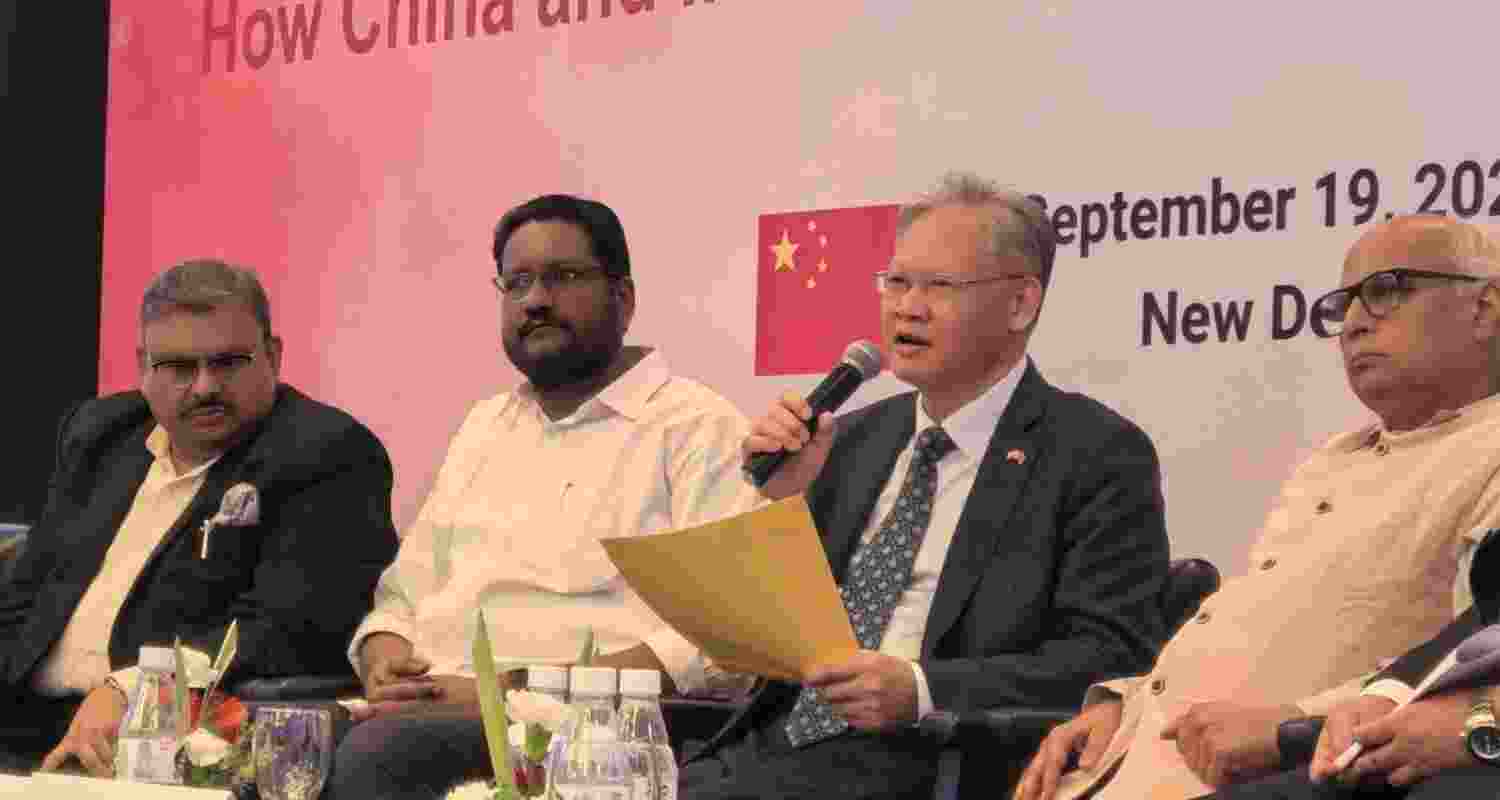 Chinese ambassador Xu Feihong answering questions at an event. Chinese ambassador Xu Feihong answering questions at an event.