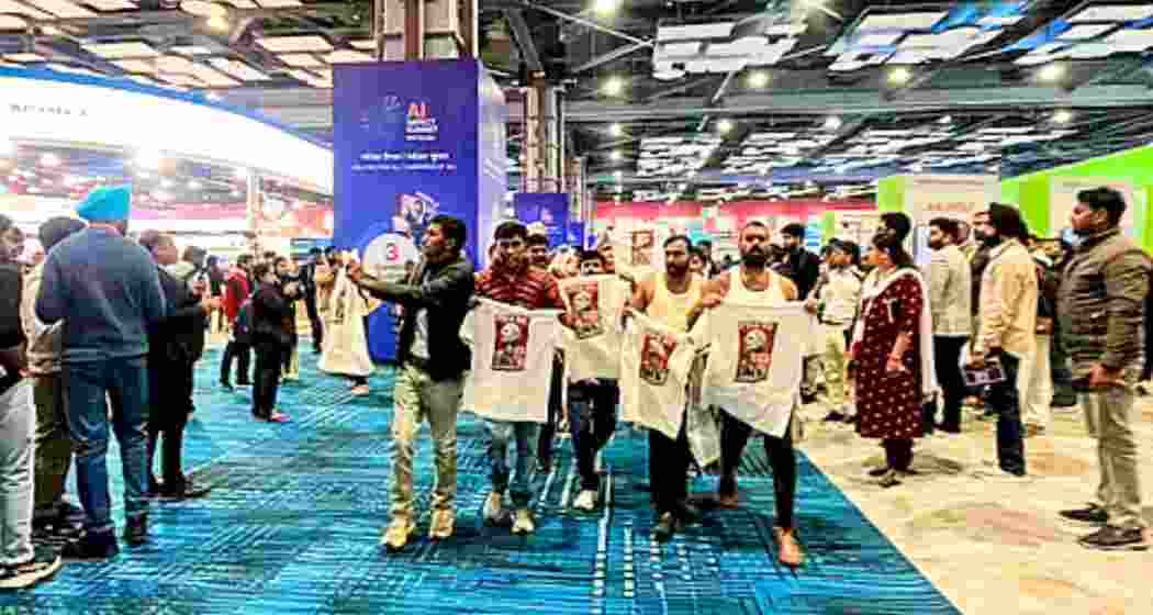 Indian Youth Congress (IYC) workers hold a ‘shirtless protest’ at the AI Impact Summit in New Delhi, displaying T-shirts with slogans against the government and the India-US trade deal on February 20. Indian Youth Congress (IYC) workers hold a ‘shirtless protest’ at the AI Impact Summit in New Delhi, displaying T-shirts with slogans against the government and the India-US trade deal on February 20.