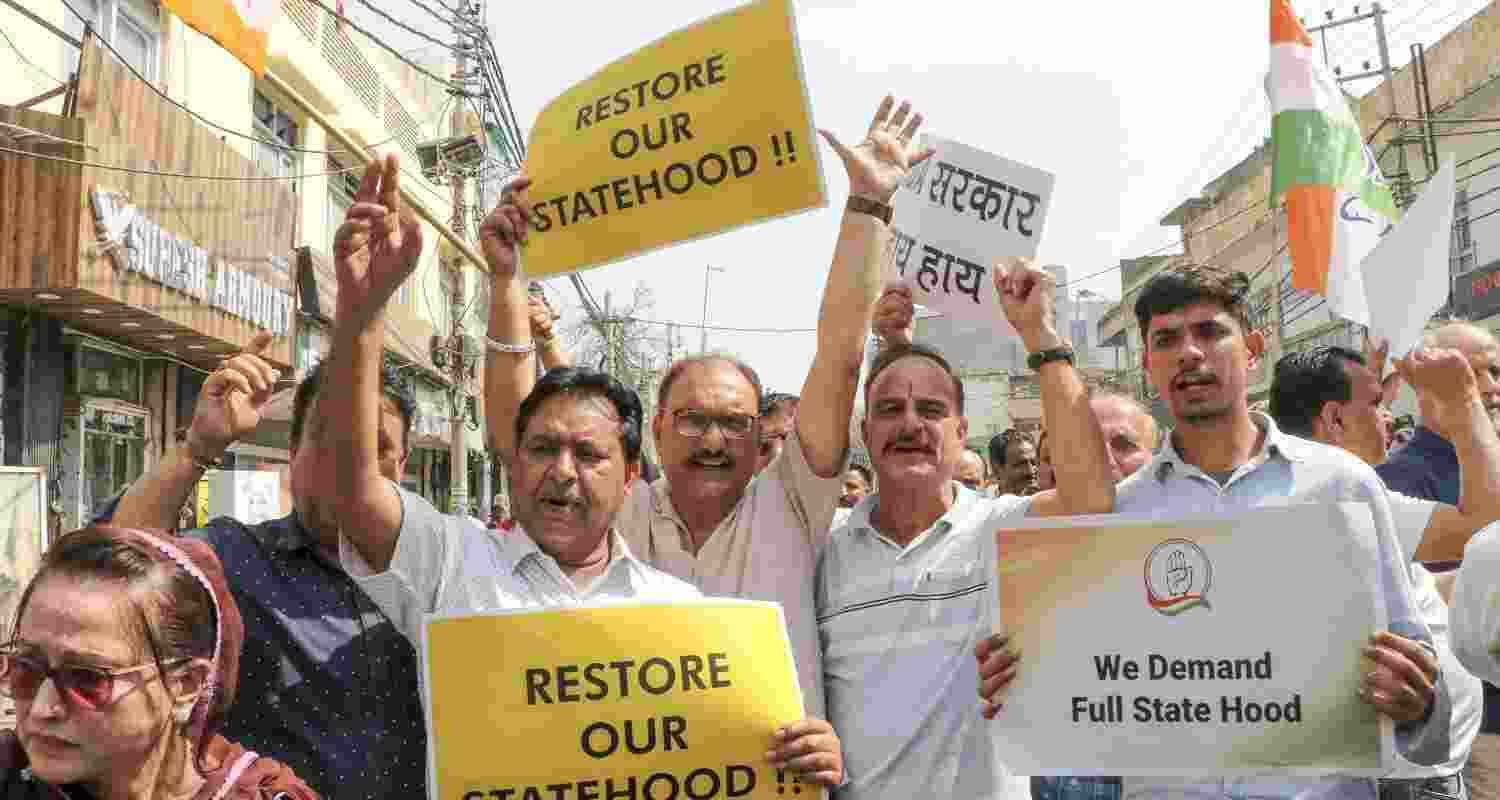 Congress workers stage a protest against the US trade deal and demand restoration of statehood for Jammu and Kashmir outside the party office, in Jammu, on Monday Congress workers stage a protest against the US trade deal and demand restoration of statehood for Jammu and Kashmir outside the party office, in Jammu, on Monday