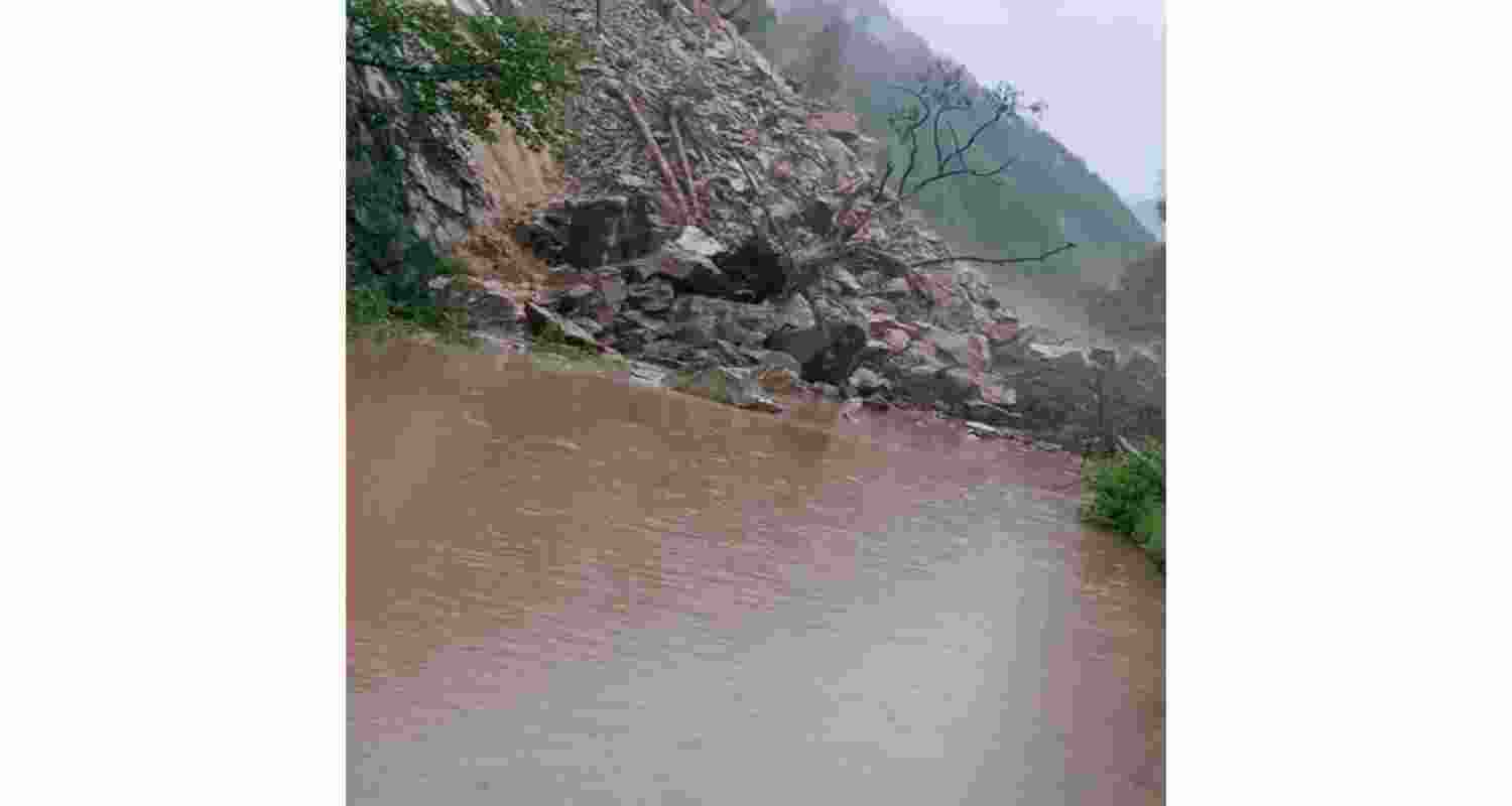 Debris blocks the Badrinath National Highway near Helang in Chamoli. Debris blocks the Badrinath National Highway near Helang in Chamoli.