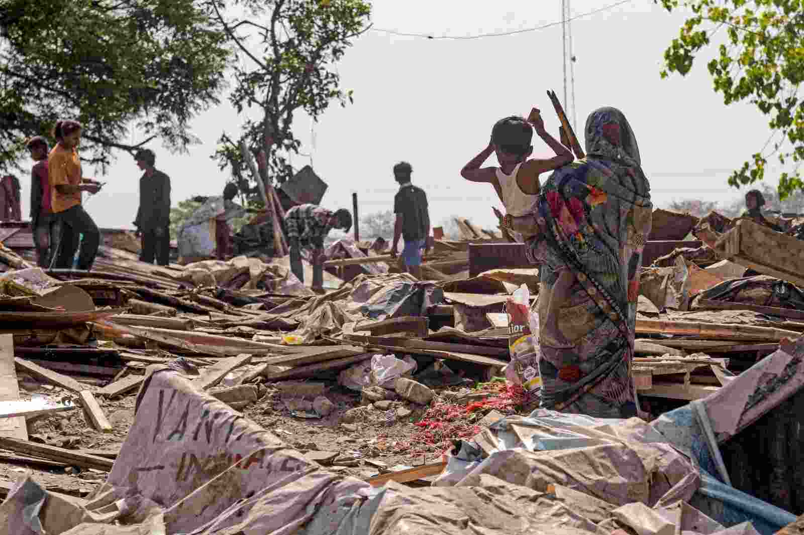 People search for their valuables in the rubbles after a demolition drive at the Sanjay Colony in Chandigarh on Wednesday. People search for their valuables in the rubbles after a demolition drive at the Sanjay Colony in Chandigarh on Wednesday.