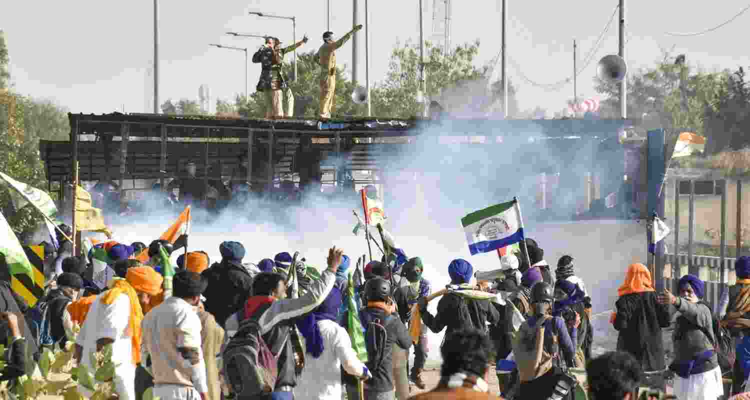 Tear gas being used by security personnel to disperse the farmers moving towards barricades during their foot march to Delhi, at Shambhu border in Patiala district, Punjab, Friday, Dec. 6, 2024. Tear gas being used by security personnel to disperse the farmers moving towards barricades during their foot march to Delhi, at Shambhu border in Patiala district, Punjab, Friday, Dec. 6, 2024.