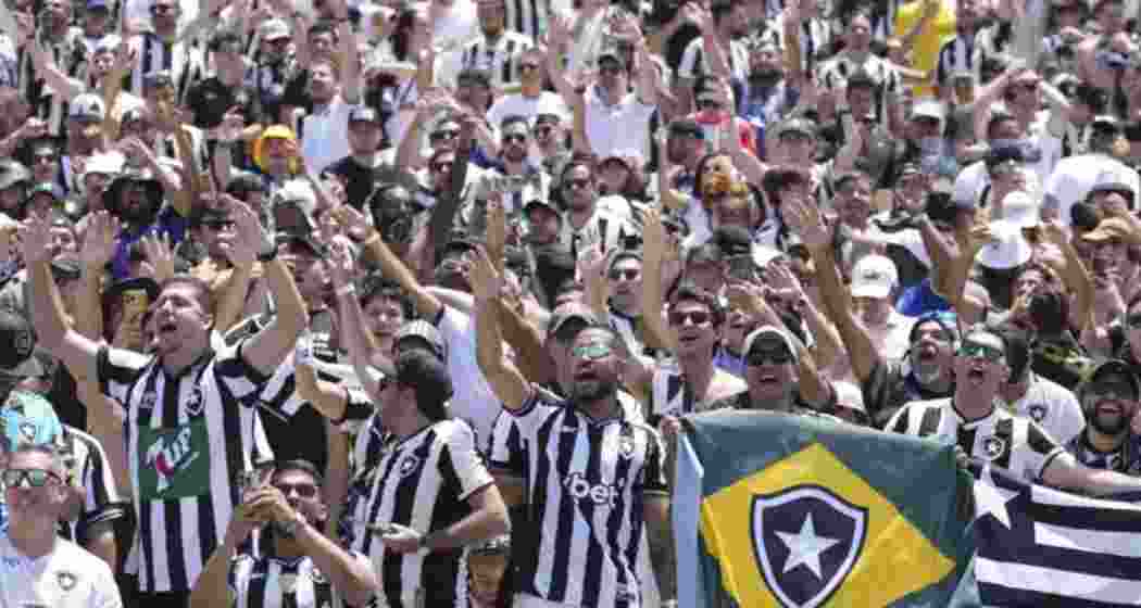 Batafogo fans cheer for their team after the Brazilian team's Club World Cup match against Atletico Madrid. Batafogo fans cheer for their team after the Brazilian team's Club World Cup match against Atletico Madrid.