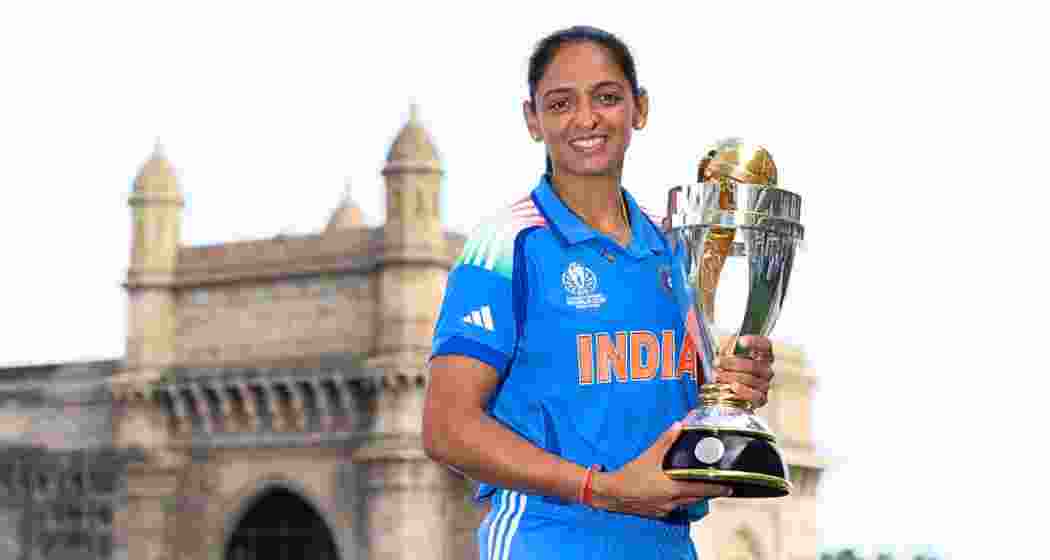 India captain Harmanpreet Kaur holds the World Cup trophy. India captain Harmanpreet Kaur holds the World Cup trophy.
