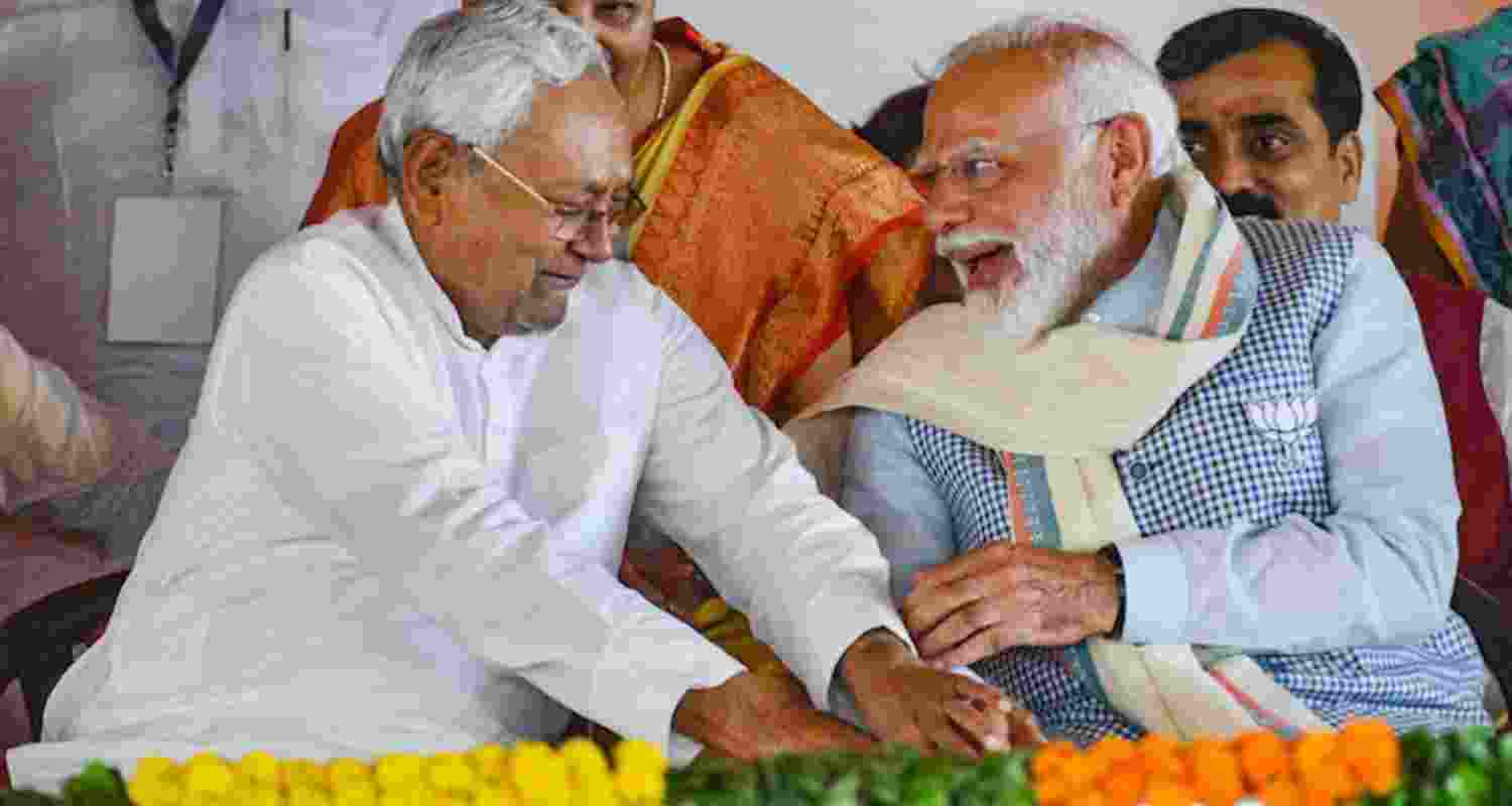 Bihar CM Nitish Kumar's feet Touching Gesture Draws Criticism from RJD's Tejashwi. Image X. Bihar CM Nitish Kumar's feet Touching Gesture Draws Criticism from RJD's Tejashwi. Image X.
